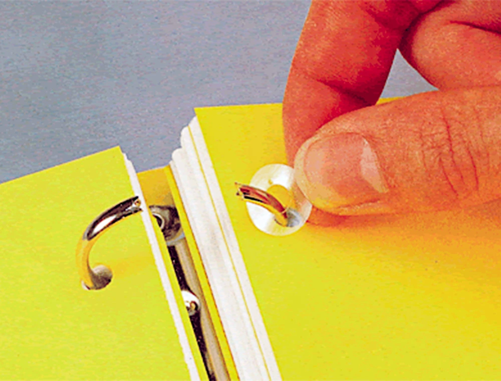 Arandela autoadhesiva blanca para reparar perforados en papel